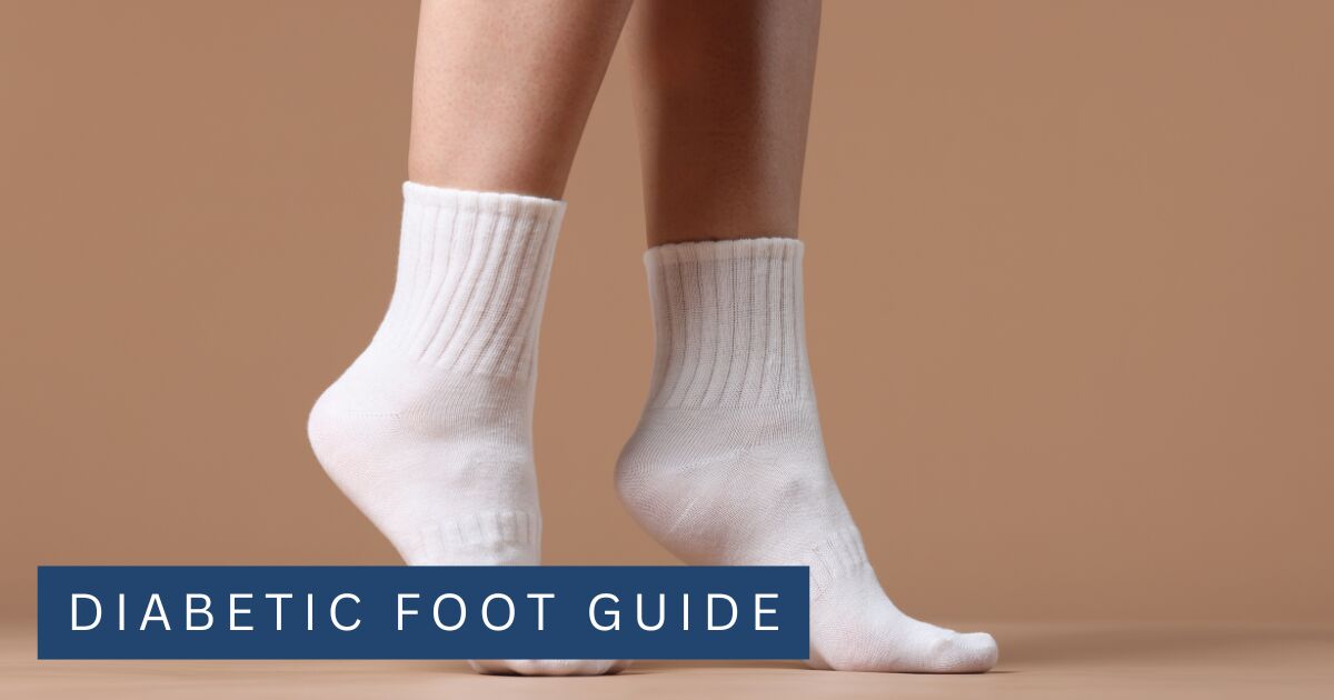 Plain seamless white cotton socks worn without shoes against a neutral background