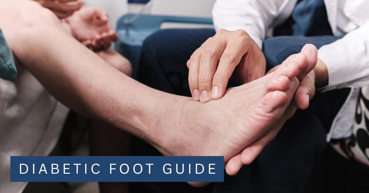 A clinician holding a patient's foot and checking the pulse during a circulation assessment